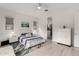 Bright main bedroom with recessed lighting, ceiling fan, and ensuite bathroom access at 8751 S 168Th Dr, Goodyear, AZ 85338