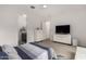Bright main bedroom with recessed lighting, ceiling fan, and ensuite bathroom access at 8751 S 168Th Dr, Goodyear, AZ 85338