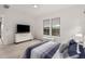 Bright main bedroom with recessed lighting, ceiling fan, and ensuite bathroom access at 8751 S 168Th Dr, Goodyear, AZ 85338