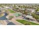 Take an aerial view of the neighborhood park with its basketball court, playground, and green spaces, close to area homes at 950 E Desert Inn Dr, Chandler, AZ 85249