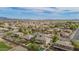 This is an aerial view of a home with a pool and covered patio in a quiet, established neighborhood at 950 E Desert Inn Dr, Chandler, AZ 85249