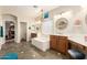 Bright primary bath features a soaking tub, vanity, and double sinks, offering style and functionality at 950 E Desert Inn Dr, Chandler, AZ 85249