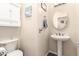Charming powder room with pedestal sink and decorative accents at 950 E Desert Inn Dr, Chandler, AZ 85249