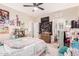 Cozy bedroom with plush carpet, ceiling fan, and ample natural light, creating a welcoming retreat at 950 E Desert Inn Dr, Chandler, AZ 85249