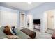 Bedroom features a closet, white doors, and a decorative glass door at 950 E Desert Inn Dr, Chandler, AZ 85249