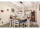 A dining room with wooden table, seating for six, and modern lighting fixtures at 950 E Desert Inn Dr, Chandler, AZ 85249