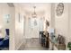 Inviting entryway featuring tile floors, a decorative console table, and a stylish front door at 950 E Desert Inn Dr, Chandler, AZ 85249