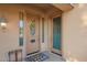 Welcoming front door with decorative wreath, stylish welcome mat, and charming sidelight at 950 E Desert Inn Dr, Chandler, AZ 85249