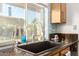 Kitchen sink with granite countertop, a window view, and modern faucet at 950 E Desert Inn Dr, Chandler, AZ 85249