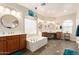 Elegant main bathroom with soaking tub, double sinks, and vanity area at 950 E Desert Inn Dr, Chandler, AZ 85249