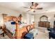 Well-lit main bedroom with furniture, ceiling fan and soft carpet at 950 E Desert Inn Dr, Chandler, AZ 85249