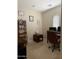 Cozy home office with neutral carpet, minimalist decor, and modern computer equipment and storage at 950 E Desert Inn Dr, Chandler, AZ 85249