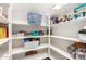 Walk-in pantry with ample shelving to neatly organize food and kitchen essentials at 950 E Desert Inn Dr, Chandler, AZ 85249