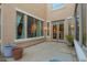 Private patio featuring large windows and an access to the backyard at 950 E Desert Inn Dr, Chandler, AZ 85249