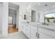 Modern bathroom featuring double sinks, white cabinetry, and stylish fixtures at 100 W Northern Ave # 4, Phoenix, AZ 85021