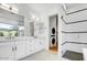 Contemporary bathroom with double vanity, walk-in shower, and laundry at 100 W Northern Ave # 4, Phoenix, AZ 85021