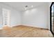 Bright bedroom with wood floors, white trim, and large windows at 100 W Northern Ave # 4, Phoenix, AZ 85021