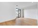 Light bedroom showcasing hardwood floors and large windows for ample natural light at 100 W Northern Ave # 4, Phoenix, AZ 85021
