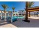 Beautiful community pool area with cabanas, lounge chairs, palm trees, and inviting atmosphere at 100 W Northern Ave # 4, Phoenix, AZ 85021