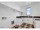 Bright laundry room featuring modern countertops, black and white flooring, and ample storage space at 100 W Northern Ave # 4, Phoenix, AZ 85021
