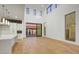 Open-concept living area with a modern kitchen and sliding glass doors to the backyard at 100 W Northern Ave # 4, Phoenix, AZ 85021
