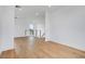 Spacious living area featuring hardwood floors, neutral paint and modern railings at 100 W Northern Ave # 4, Phoenix, AZ 85021