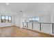 Bright, open-concept living space with hardwood floors and large windows offering panoramic views at 100 W Northern Ave # 4, Phoenix, AZ 85021