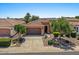 Charming single-story home featuring a well-manicured front yard and a two-car garage at 1449 E Artemis Trl, Queen Creek, AZ 85140