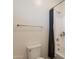 Bathroom featuring a bathtub with shower, toilet, and towel rack at 300 N Gila Springs Blvd # 144, Chandler, AZ 85226