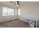 Bright bedroom with carpeted floors, a ceiling fan, and two windows providing natural light at 300 N Gila Springs Blvd # 144, Chandler, AZ 85226
