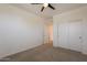 Spacious bedroom featuring a sliding door closet, and ceiling fan at 300 N Gila Springs Blvd # 144, Chandler, AZ 85226