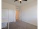 Bedroom with a large closet featuring sliding doors, offering ample storage space at 300 N Gila Springs Blvd # 144, Chandler, AZ 85226