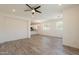 Open floor plan with wood-look floors connecting the living room and kitchen at 300 N Gila Springs Blvd # 144, Chandler, AZ 85226