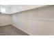 Spacious walk-in closet featuring carpeted floor and white walls with shelving unit at 300 N Gila Springs Blvd # 144, Chandler, AZ 85226