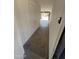 A view into the garage of this home from the entry area showing ample space and potential at 5948 W Holly St, Phoenix, AZ 85035