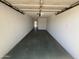 Spacious one-car garage with painted walls and interior access, ready for your vehicle and storage needs at 5948 W Holly St, Phoenix, AZ 85035