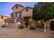 Inviting two-story home with a three car garage and desert landscaping at 6971 W El Cortez Pl, Peoria, AZ 85383