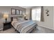 Cozy bedroom with a queen-sized bed, neutral tones, and decorative artwork at 10543 E Sahuaro Dr, Scottsdale, AZ 85259