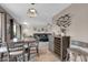 Open-concept dining area with stylish furnishings, seamlessly connecting to the living room for easy entertaining at 10543 E Sahuaro Dr, Scottsdale, AZ 85259
