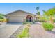 Charming single-story home with a well-maintained yard and a two-car garage at 10543 E Sahuaro Dr, Scottsdale, AZ 85259
