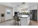 Modern kitchen with white cabinetry, stainless steel appliances, and a center island at 10543 E Sahuaro Dr, Scottsdale, AZ 85259