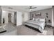 Serene main bedroom with neutral tones, ceiling fan, soft carpet, and an ensuite bathroom at 10543 E Sahuaro Dr, Scottsdale, AZ 85259