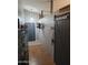 Open entryway to an interior with a decorative wooden wall, hats, and hard wood flooring at 11590 W Cocopah St, Avondale, AZ 85323