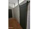 Welcoming entryway with wood-look floors and gray sliding barn door at 11590 W Cocopah St, Avondale, AZ 85323
