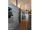 Interior entryway with hats, cowboy themed art, and hard wood flooring at 11590 W Cocopah St, Avondale, AZ 85323