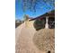 Low maintenance front yard with gravel landscaping and charming front porch at 11590 W Cocopah St, Avondale, AZ 85323