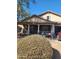 Inviting single-story home with a charming front porch and manicured landscaping at 11590 W Cocopah St, Avondale, AZ 85323