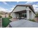 Outdoor living space boasts covered patio, hot tub, and low-maintenance turf perfect for relaxation and entertaining at 12158 S 184Th Ave, Goodyear, AZ 85338