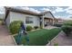 Backyard with low-maintenance landscaping, artificial turf, and covered patio, great for outdoor enjoyment at 12158 S 184Th Ave, Goodyear, AZ 85338
