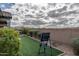 Landscaped backyard featuring artificial grass and a privacy wall perfect for outdoor activities and relaxation at 12158 S 184Th Ave, Goodyear, AZ 85338